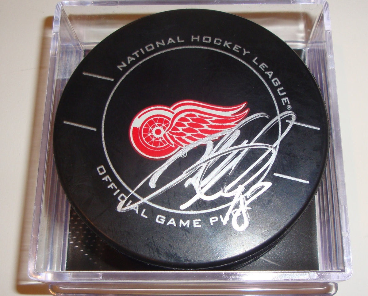 Ian White Signed Puck w/COA Detroit Red Wings Official Game Puck